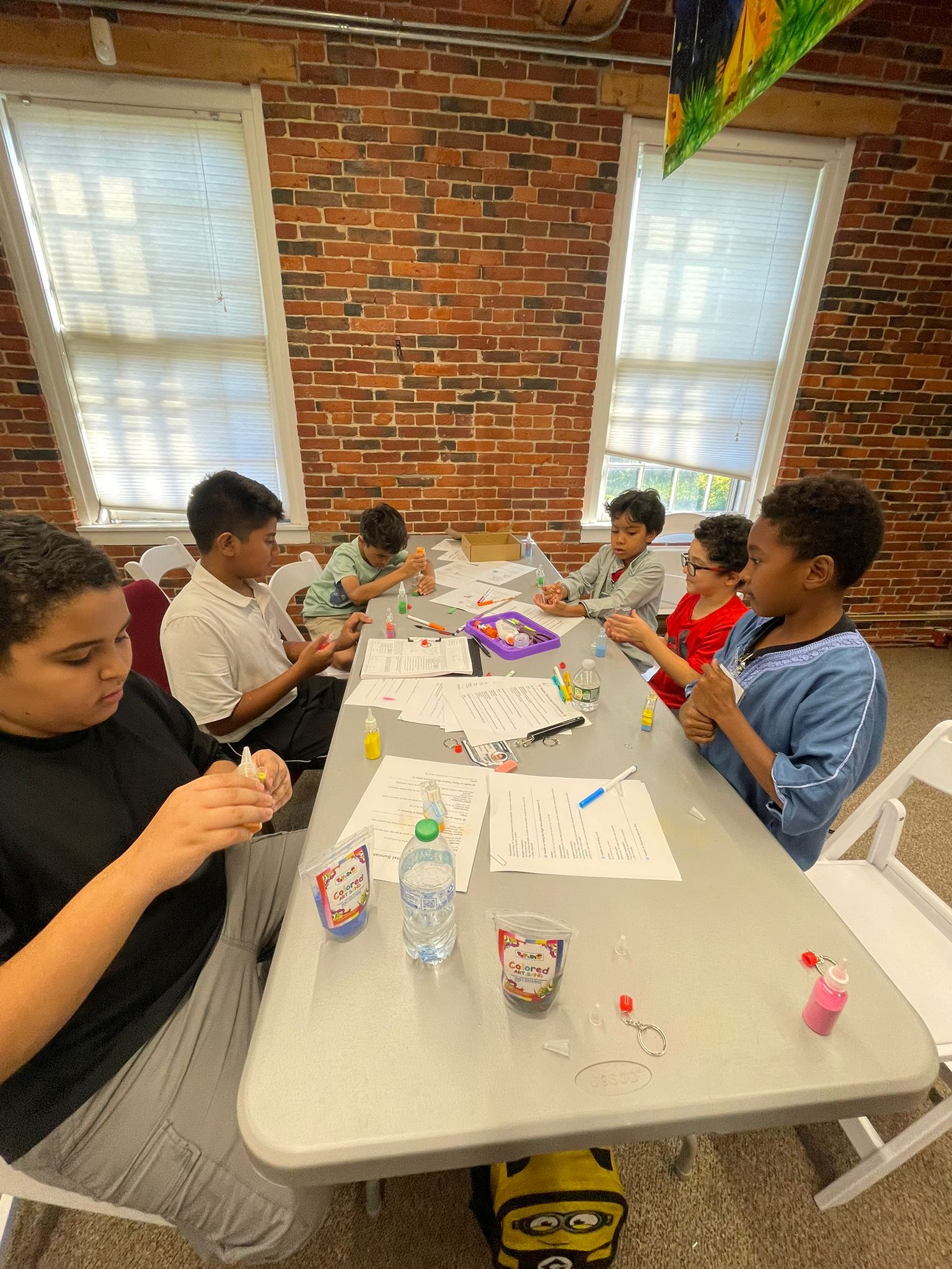 Students crafting a globe earth project